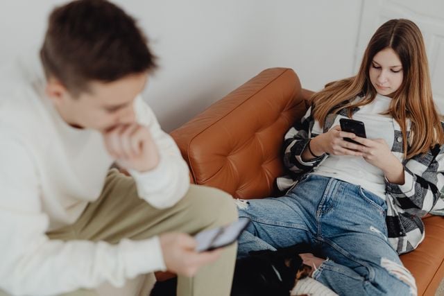 Teens scrolling instead of being present